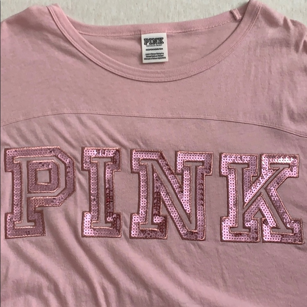 It’s a pink blouse with pink detailing.